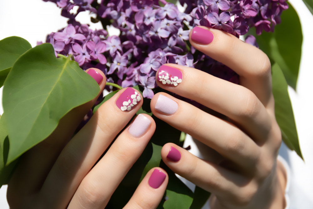 Pink Nail Design Female Hand With Pink Manicure Holding Purple Lilac