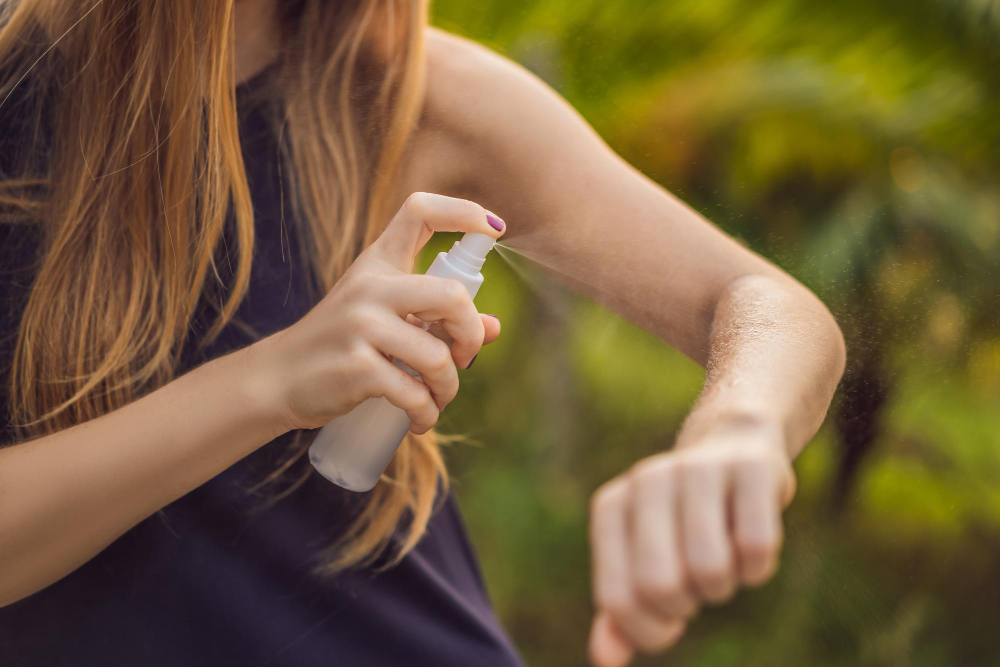 Woman Spraying Insect Repellent Skin Outdoor
