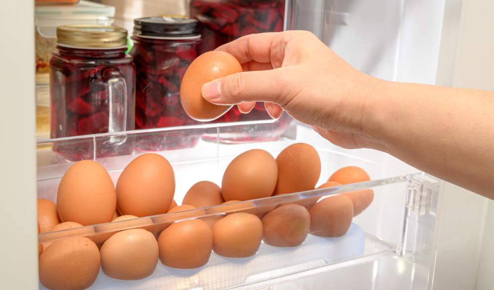 Hands Organize Brown Eggs Refrigerator Shelf
