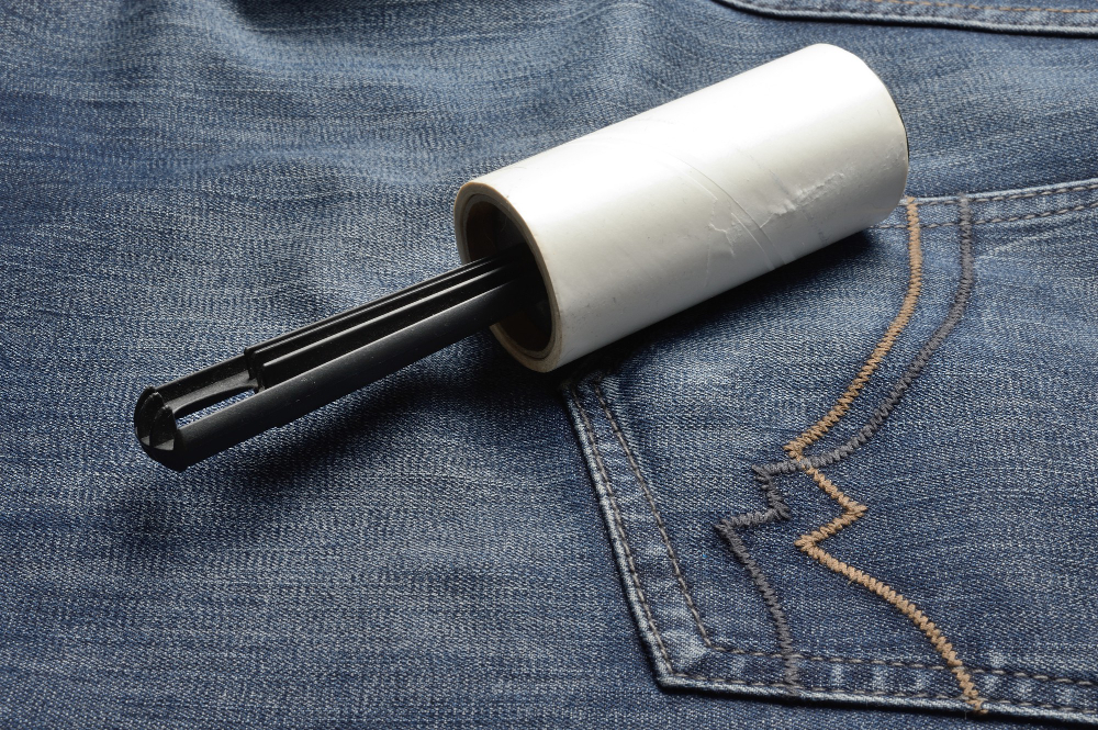 Sticky Roller Coiled Garment Brush Rests Dark Jeans