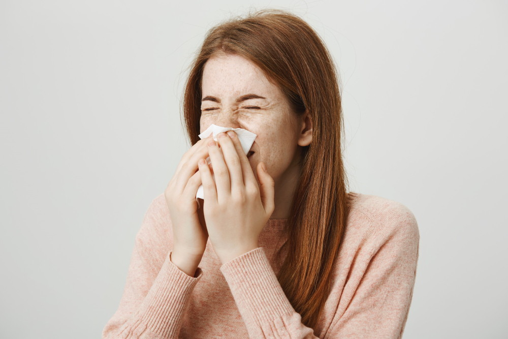 Cute Sick Redhead Girl With Allergy Sneezing Napkin