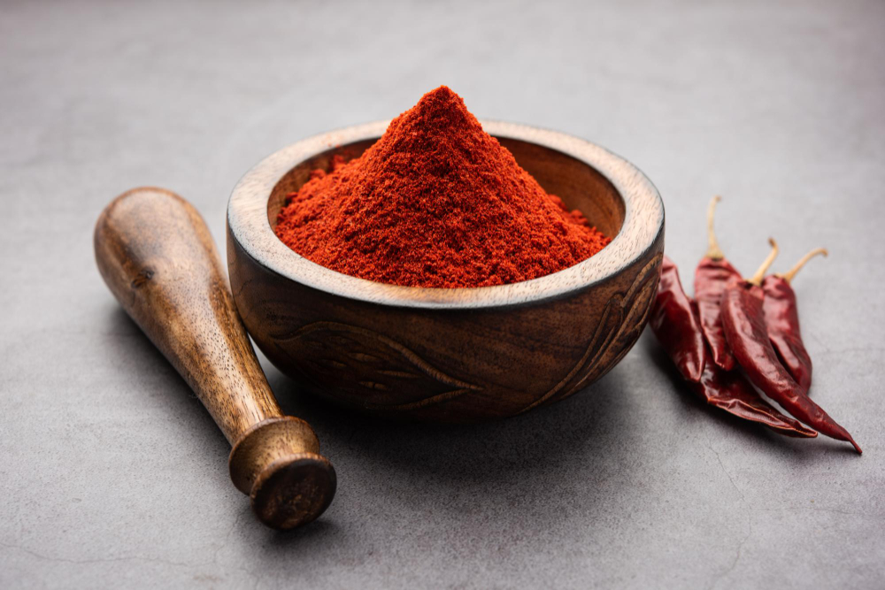 red-chilli-lal-mirchi-mirch-with-powder-bowl-mortar-moody-background-selective-focus