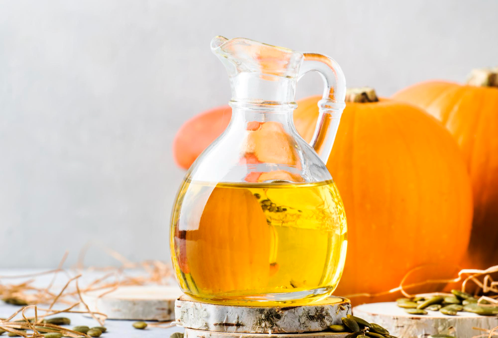 Pumpkin Seeds Oil Glass Jug White Rustic Background Copy Space Selective Focus