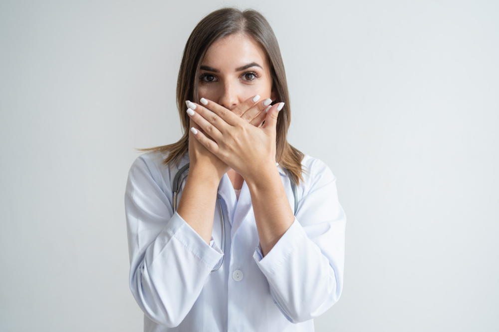 Shocked Female Caucasian Specialist Lab Coat Covering Mouth