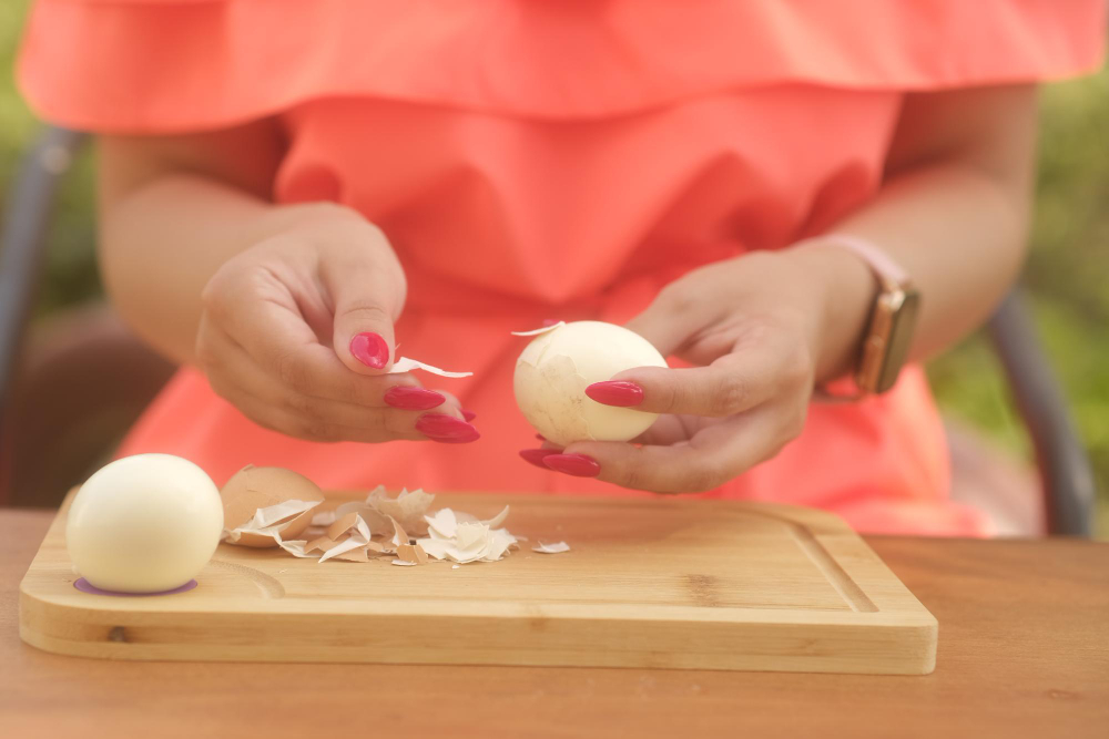 Unrecognizable Lady Peeling Boiled Egg Wooden Board Outdoors Woman S Hands With Bright Manicure Peeling Chicken Egg From Shell Wooden Board Close Up