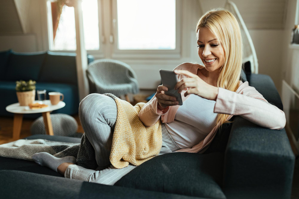 Smiling Woman Relaxing Her Living Room Text Messaging Mobile Phone