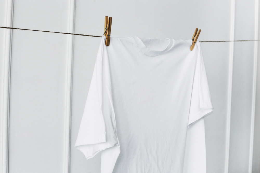 White Shirt Hanging By Wall