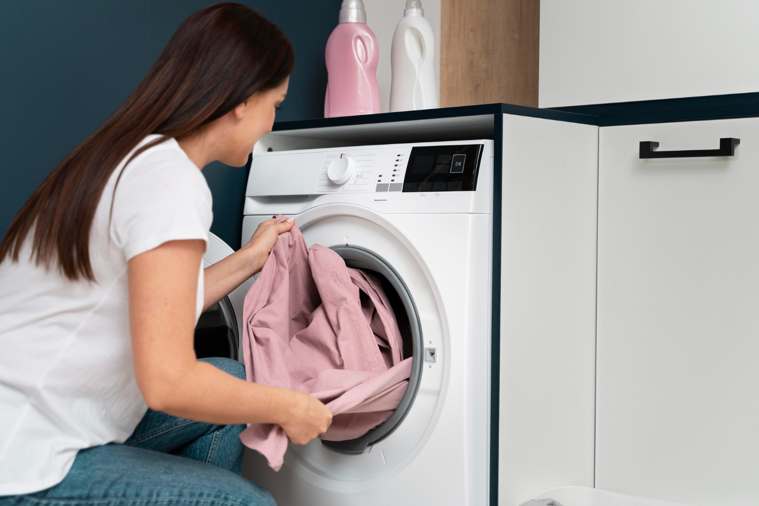 woman-taking-clothes-from-washing-machine