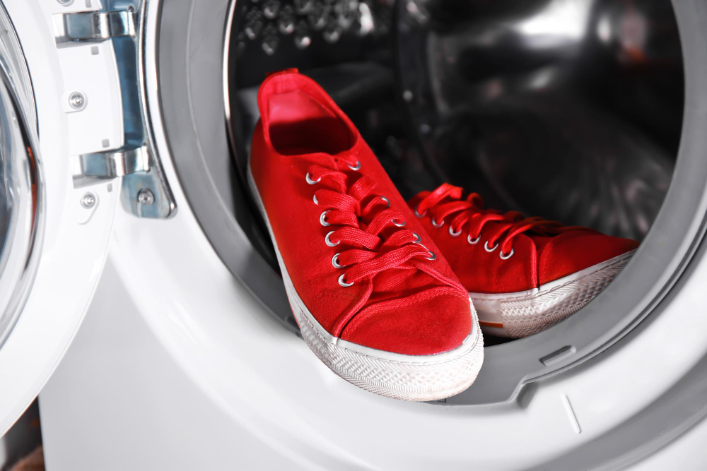 Pair Red Sneakers Washing Machine Closeup