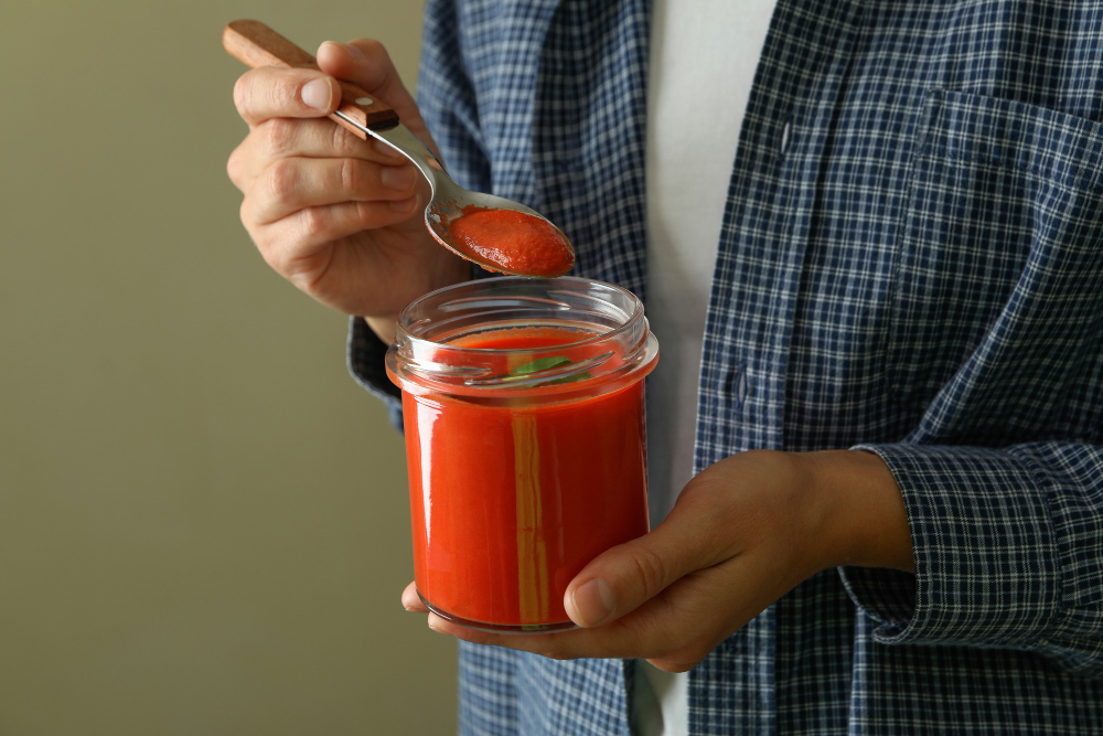 Woman Eat Gazpacho Soup From Glass Jar