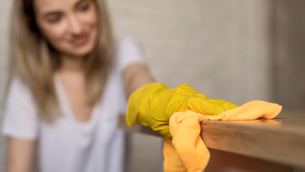front-view-defocused-woman-cleaning-surface