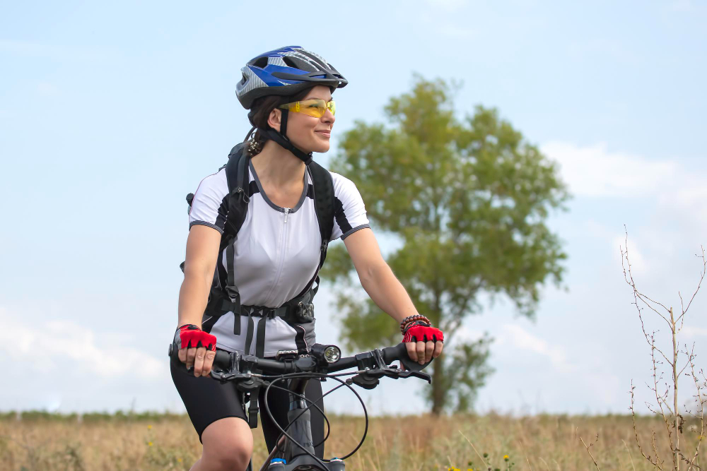beautiful-happy-woman-cyclist-rides-bicycle-road-nature-healthy-lifestyle-sports-leisure-hobbies