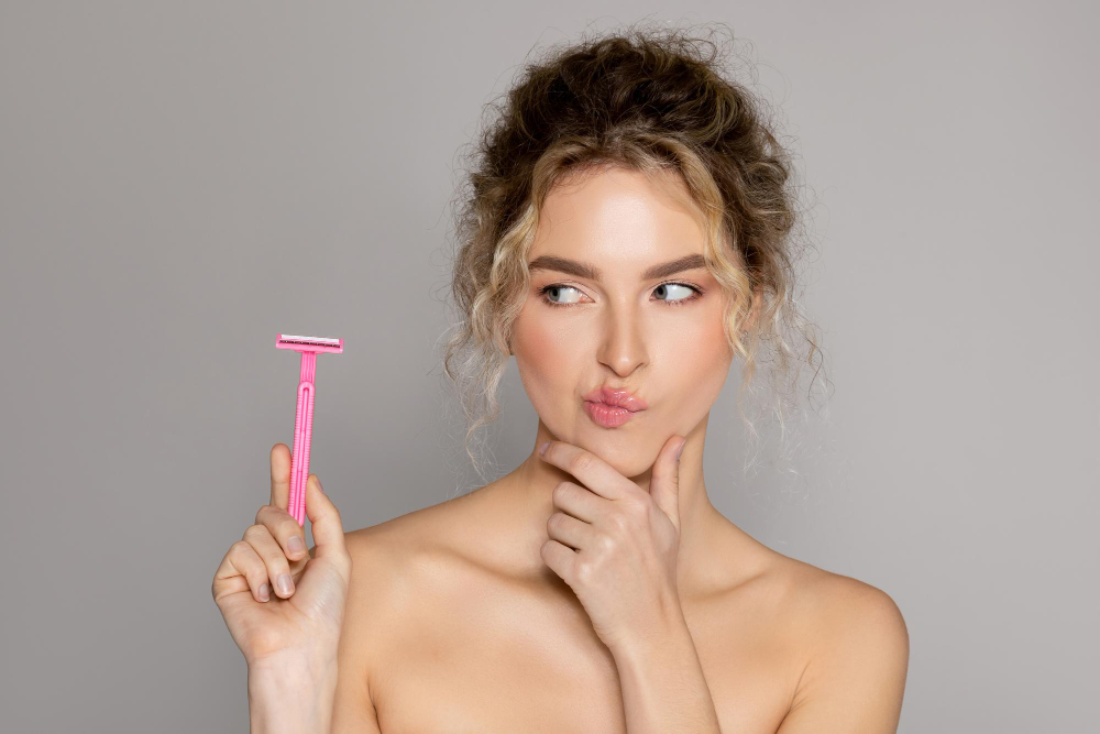 Wax Shave Portrait Young Beautiful Thoughtful Lady Looking Safety Razor Touching Chin Grey Background