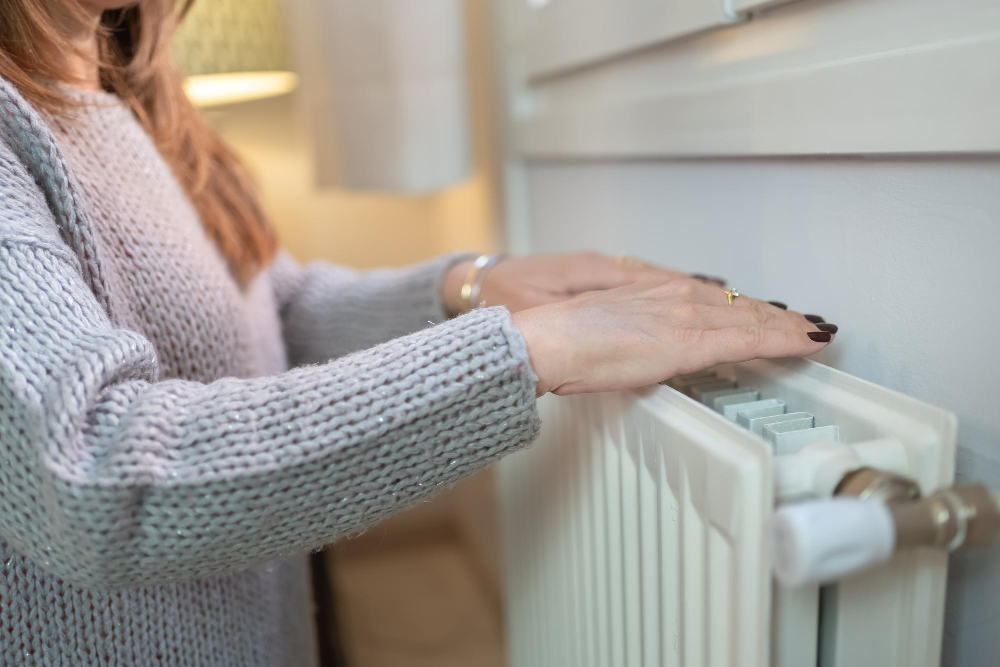 Woman Warming Her Hands Radiator Because Cold Winter