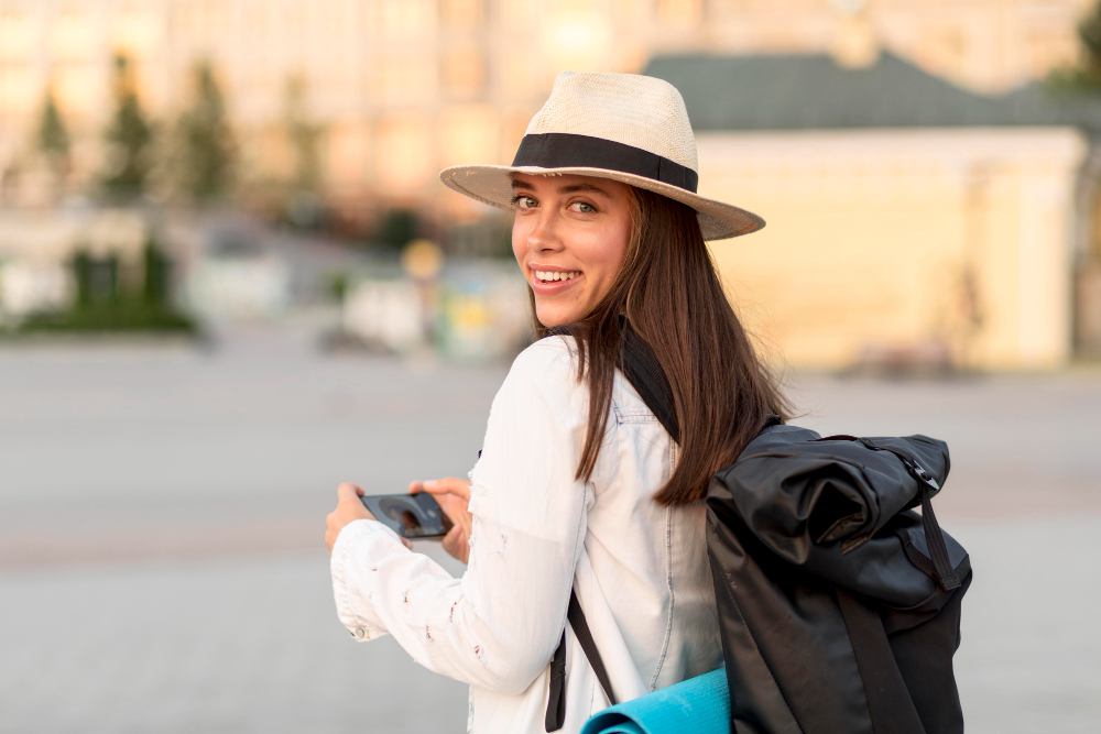 Side View Woman With Backpack Hat While Traveling Alone
