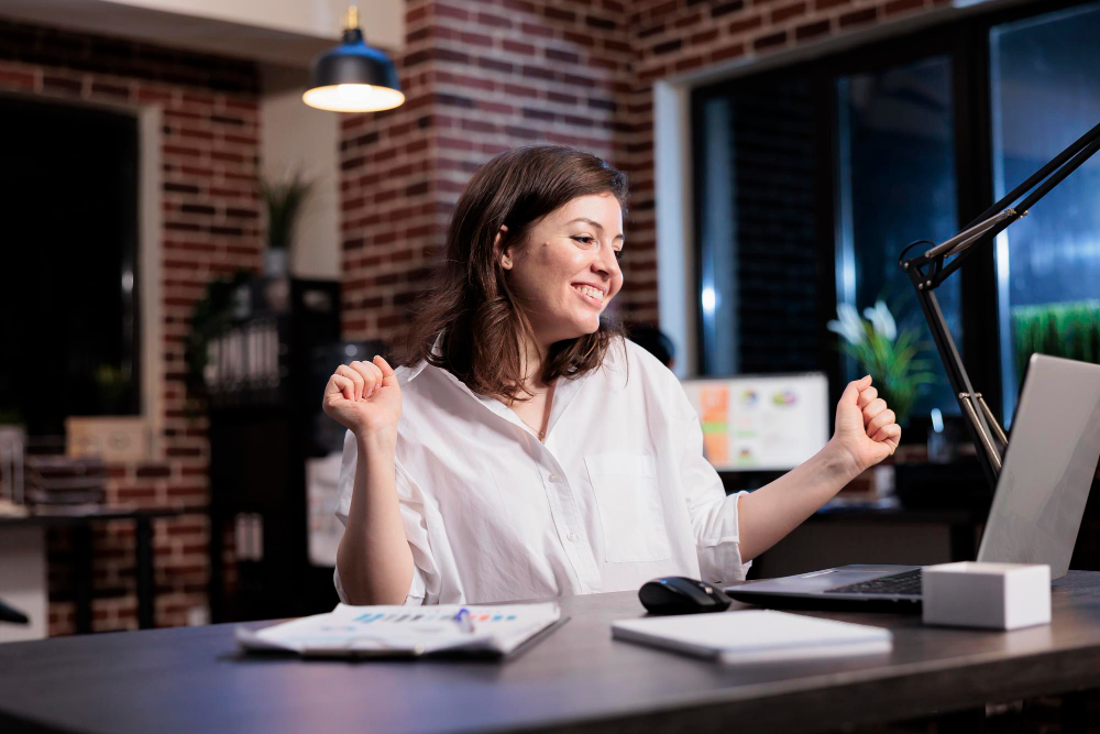 Happy Joyful Young Adult Businesswoman Celebrating Finishing Startup Project Before Deadline Enthusiastic Positive Young Adult Entrepreneur Being Excited About New Job While Office Night