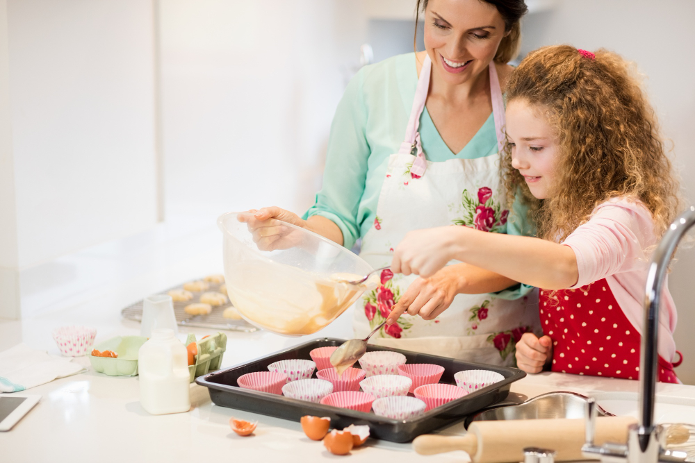 Mother Daughter Preparing Cupcake Kitchen