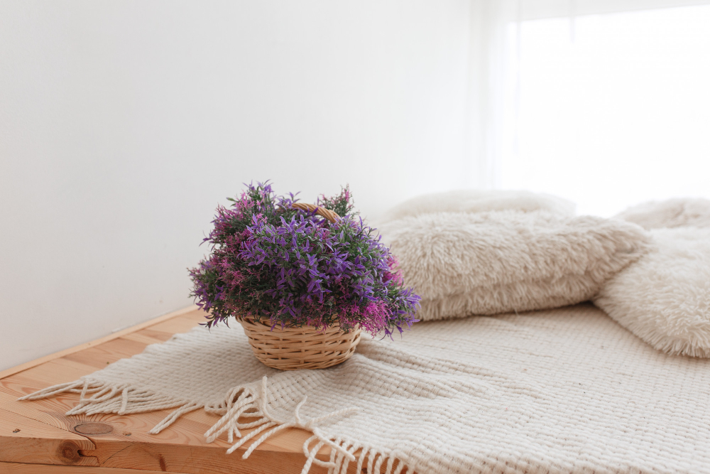 Basket Jute With Purple Flowers Wooden Floor With Knitted Pillows Covering