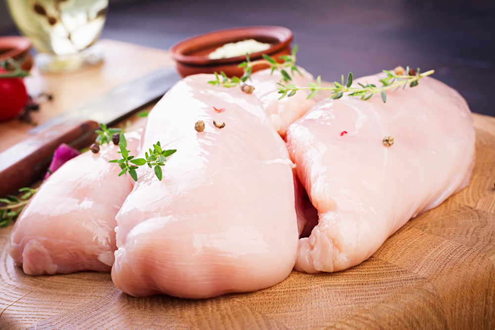 Raw Chicken Breast Fillets Wooden Cutting Board With Herbs Spices