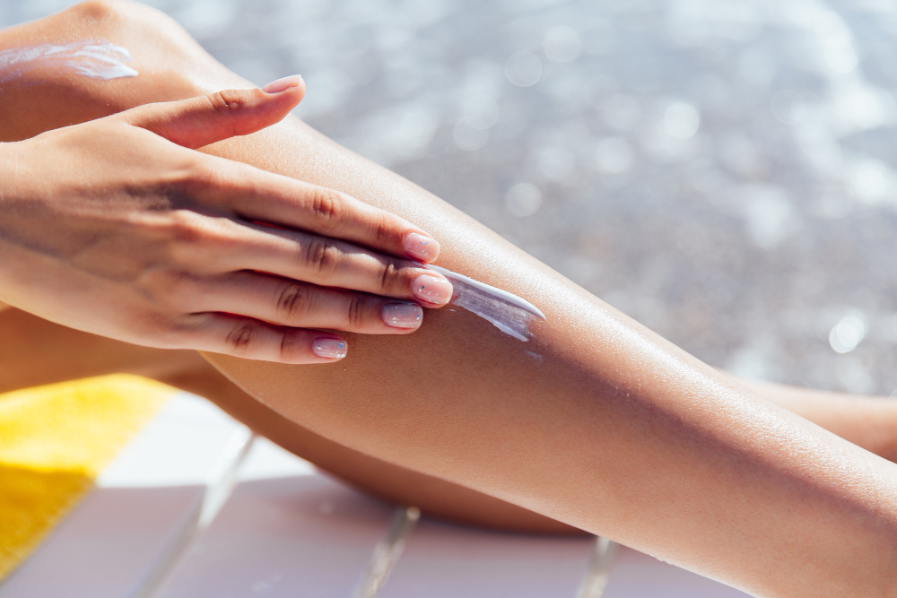 Close Up View Female Hand Applying Sunscreen Her Leg Near Sea
