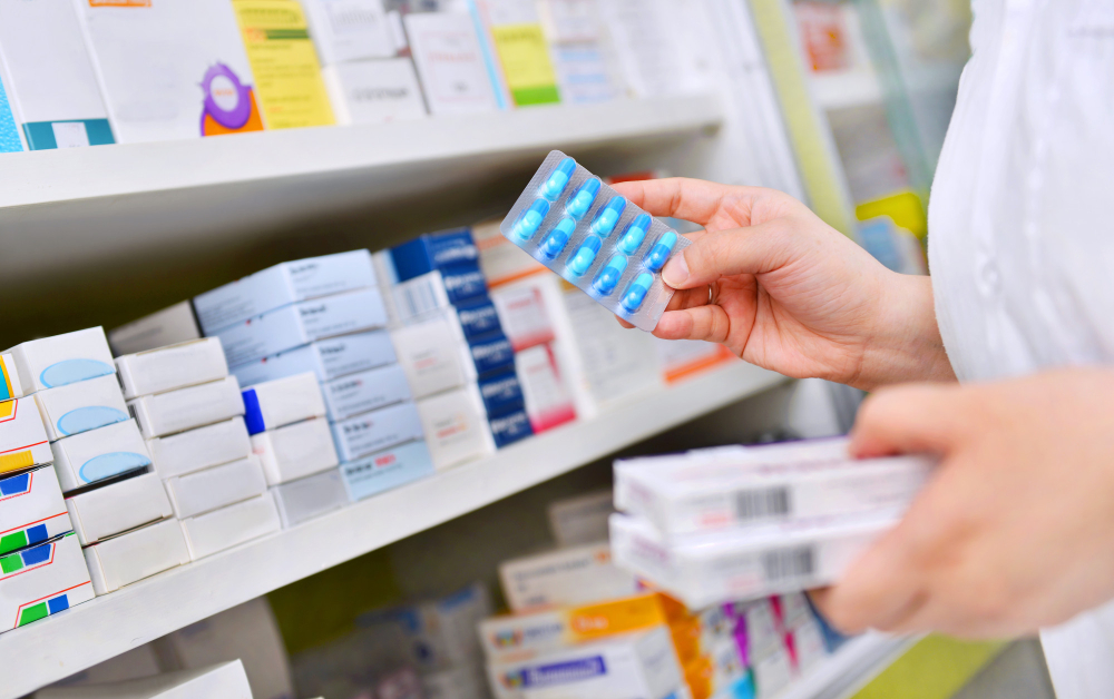 Pharmacist Holding Medicine Box Capsule Pack Pharmacy Drugstore