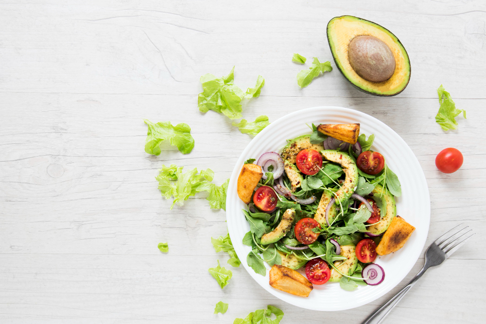 Vegan Salad With Avocado White Wooden Table