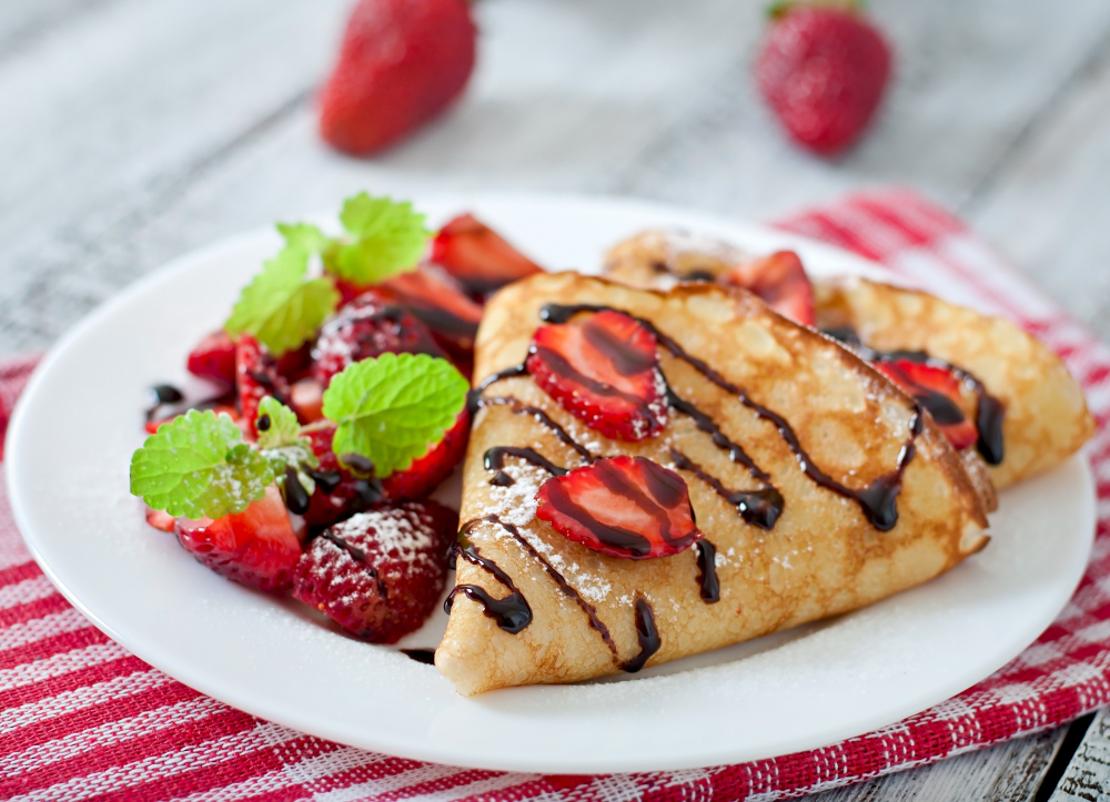 pancakes-with-strawberries-chocolate-decorated-with-mint-leaf