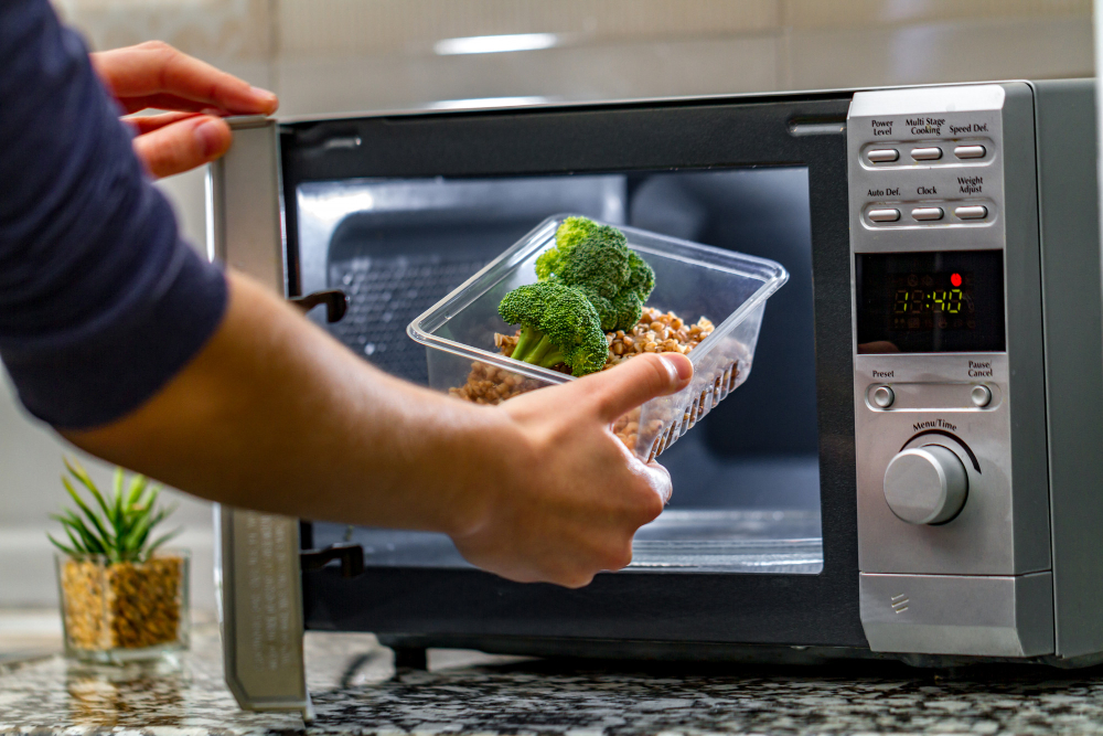 Woman S Hand Puts Plastic Container With Broccoli Buckwheat Microwave