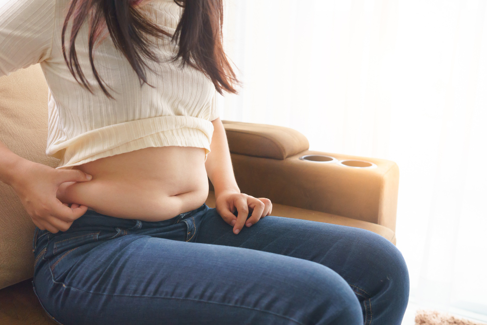 Woman Holding Her Own Belly When Sitting Down Sofa Living Room