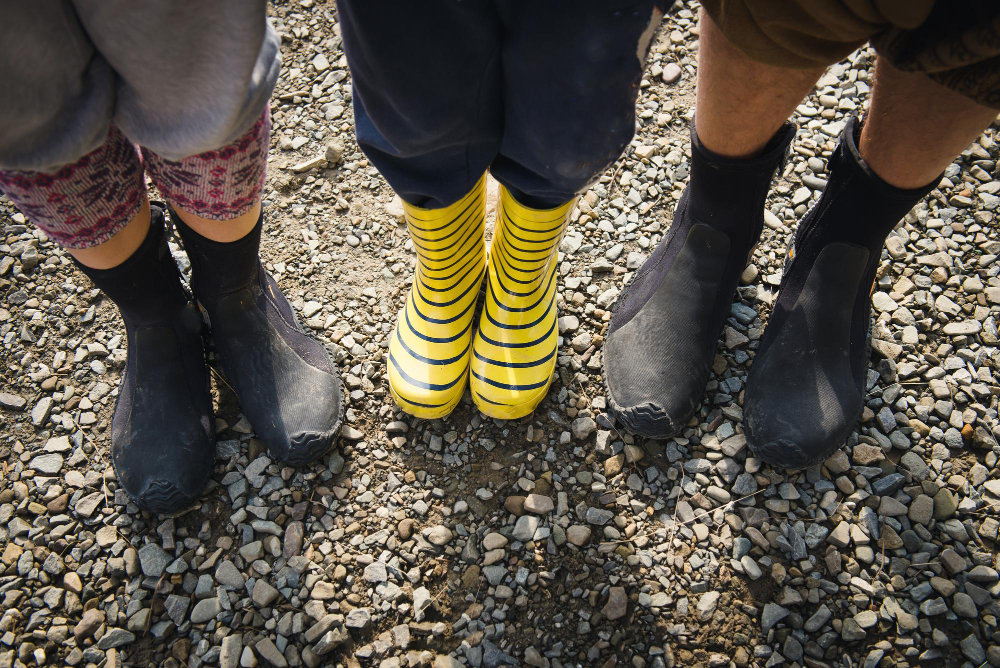 rubber-boots-family-outdoors-child-parents-gumboots-near-river-close-up