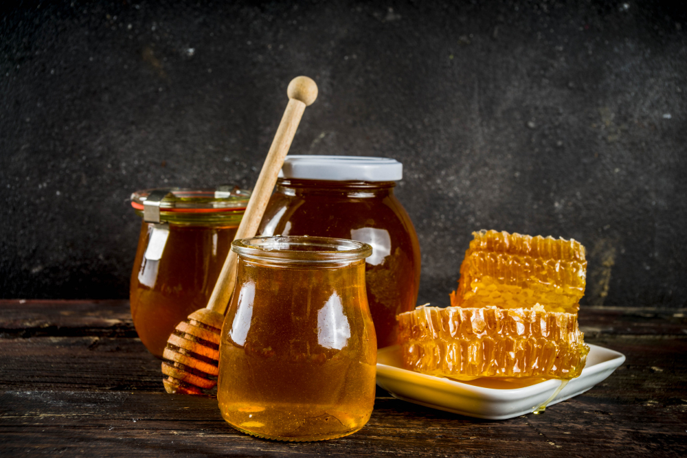 Organic Farm Honey Jars With Honeycombs