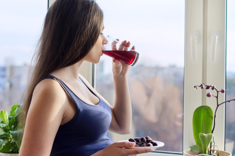 Young Woman Drinking Natural Fresh Berry Juice From Glass Closeup