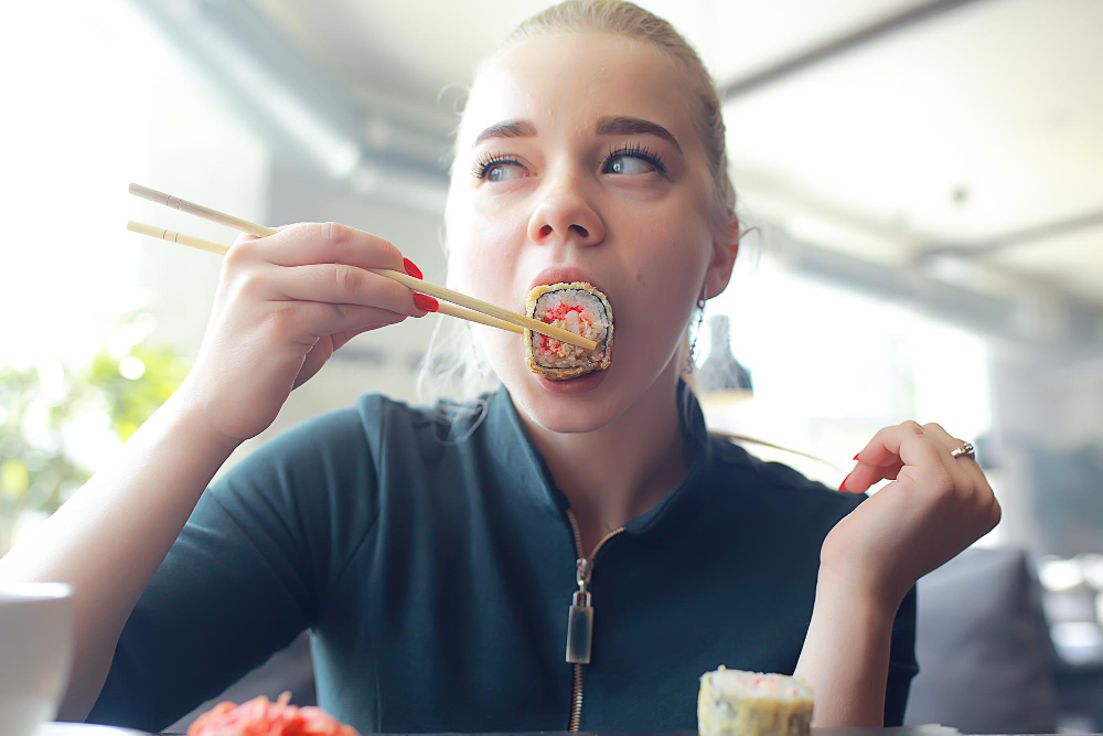 Girl Eats Sushi Rolls Restaurant Oriental Cuisine Japanese Food Young Model Restaurant